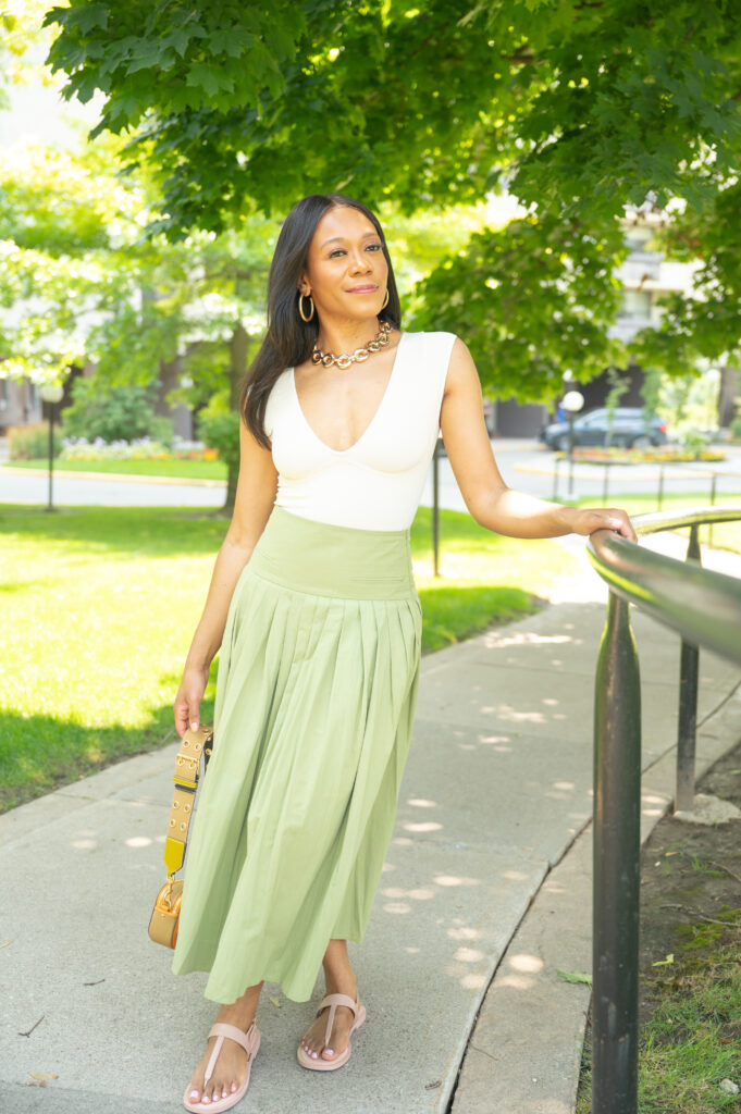 beige top and sage green skirt