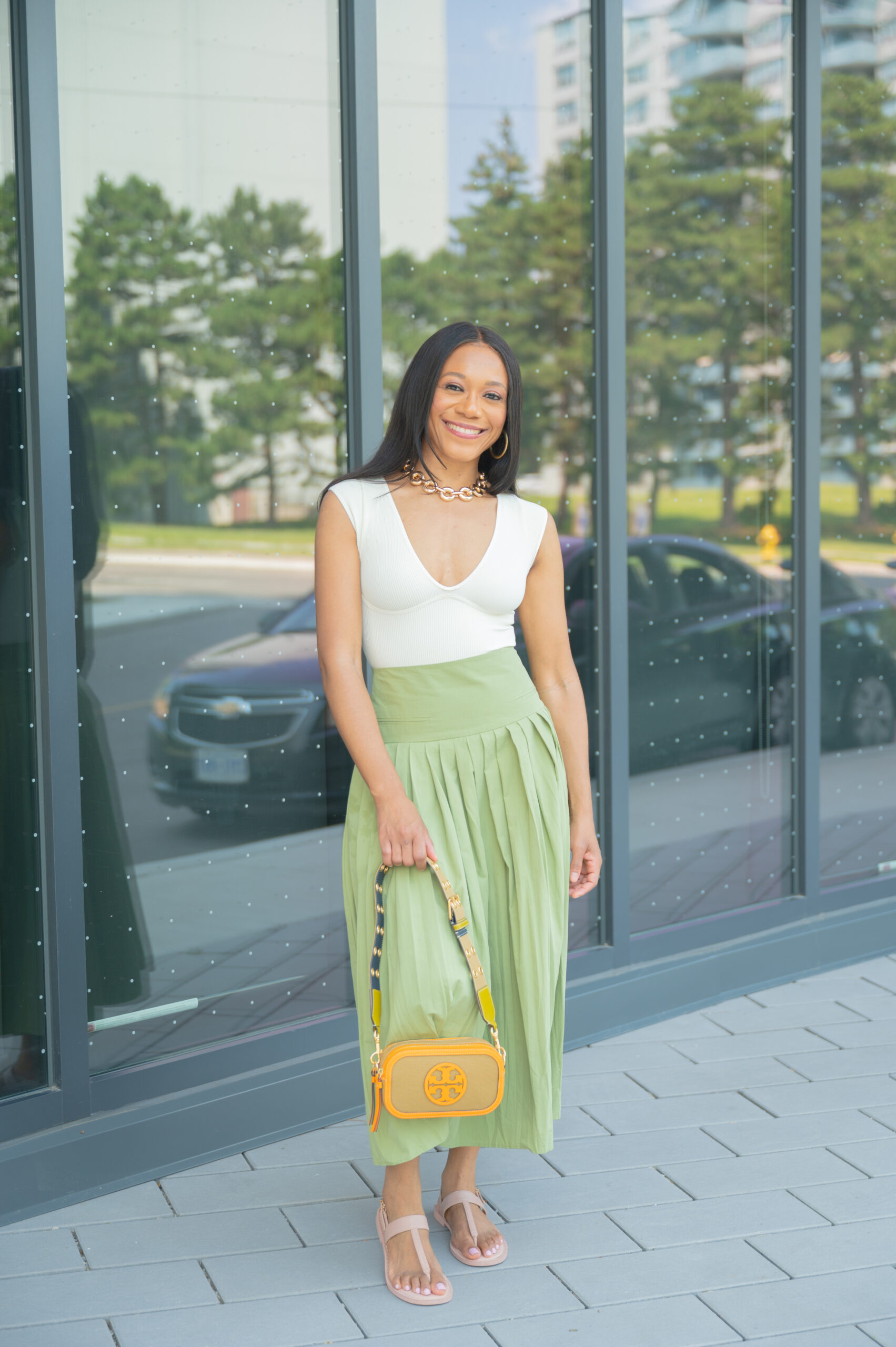 beige top and sage green skirt